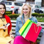 happy people concept – beautiful women with shopping bags in the